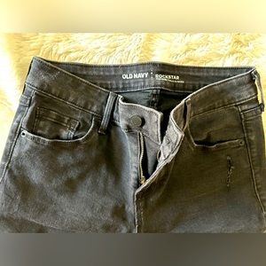 Pair of black distressed jeans